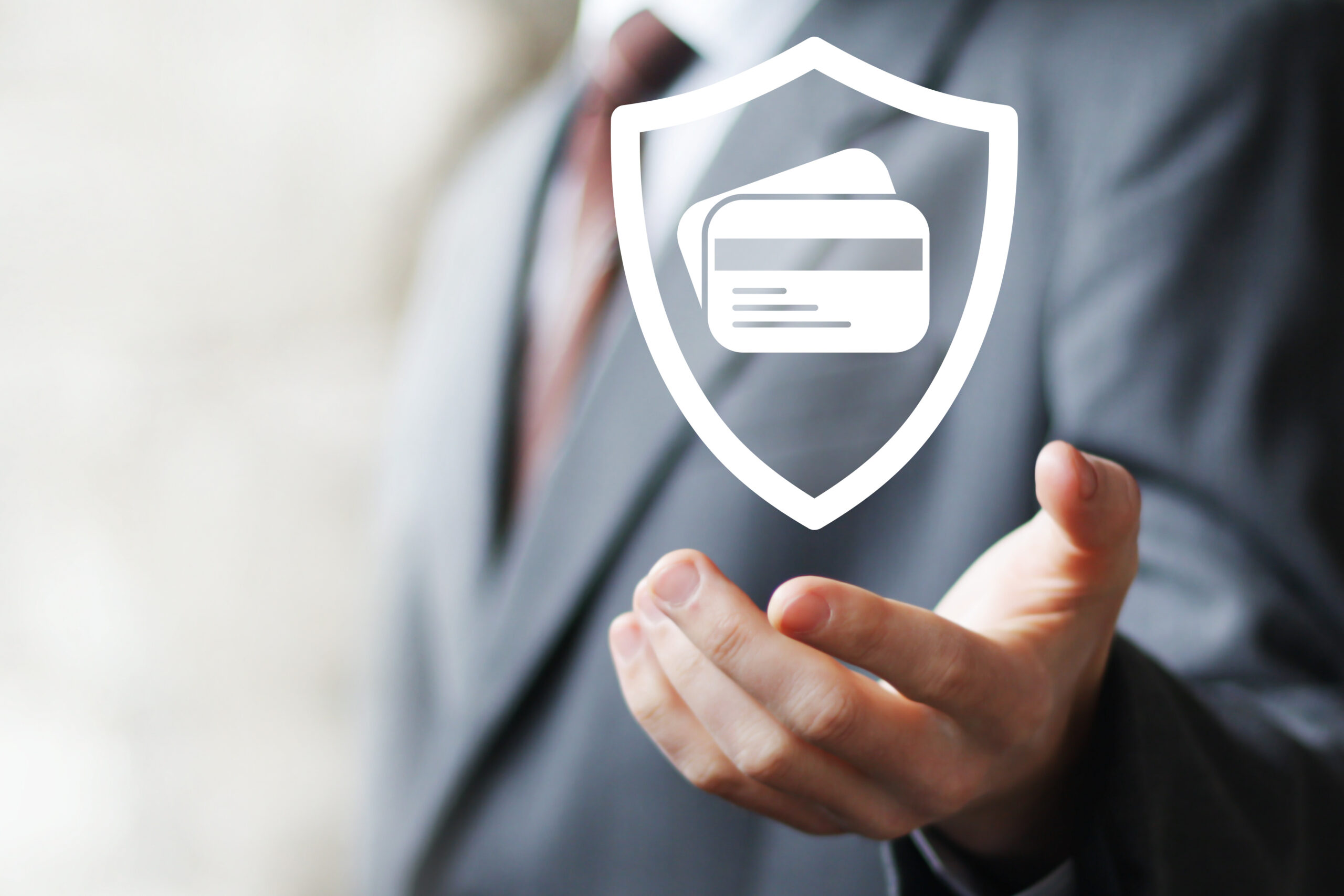 businessman pressing credit card shield security